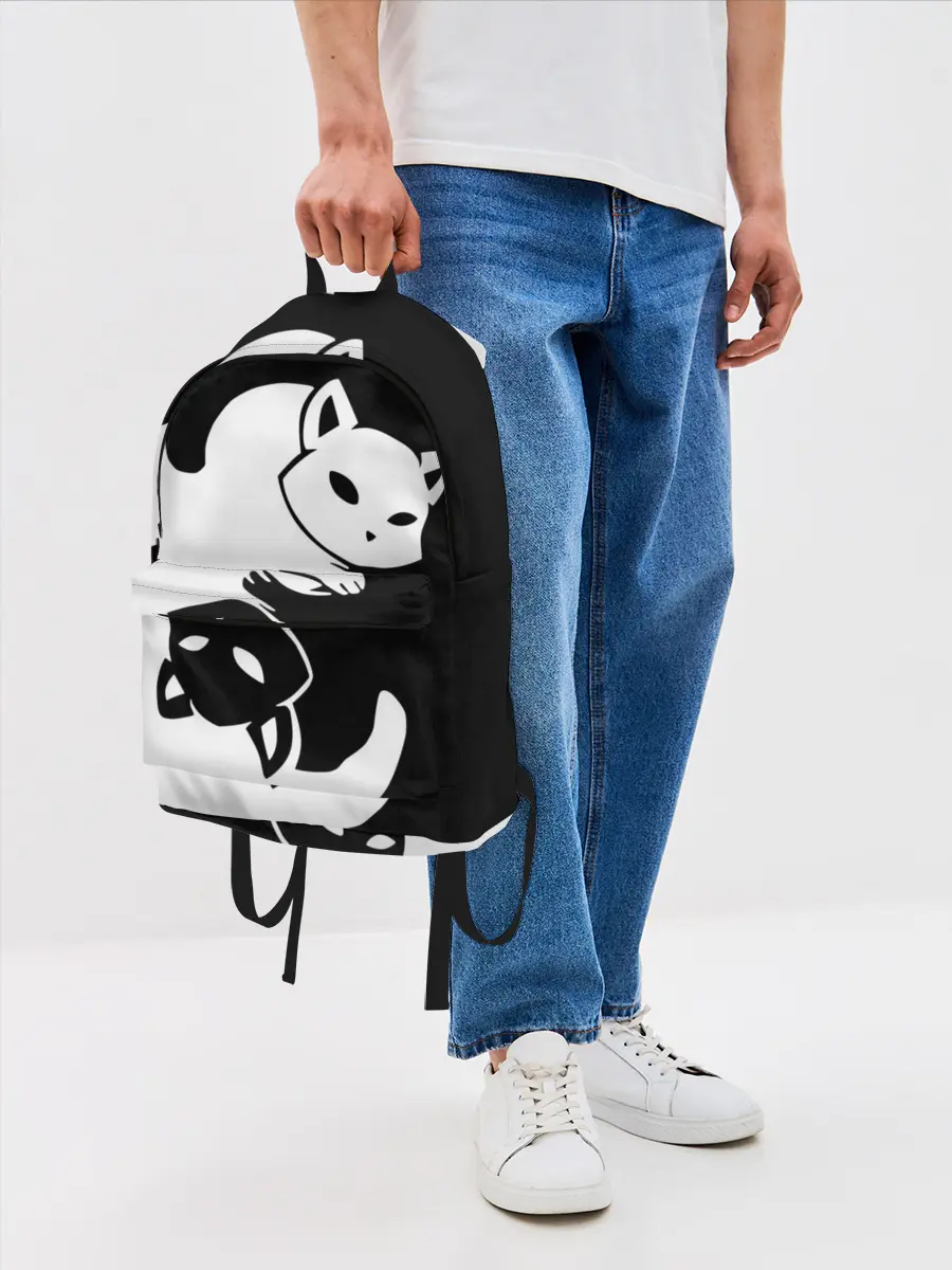 Рюкзак джинсовый / Черный и белый кот кувыркаются.